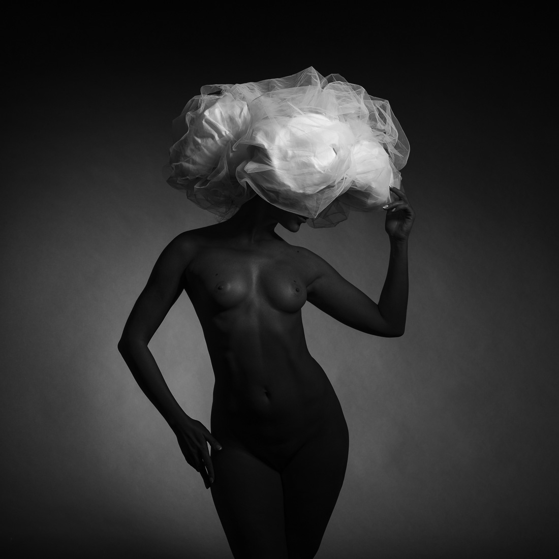 Black model and big white hat.