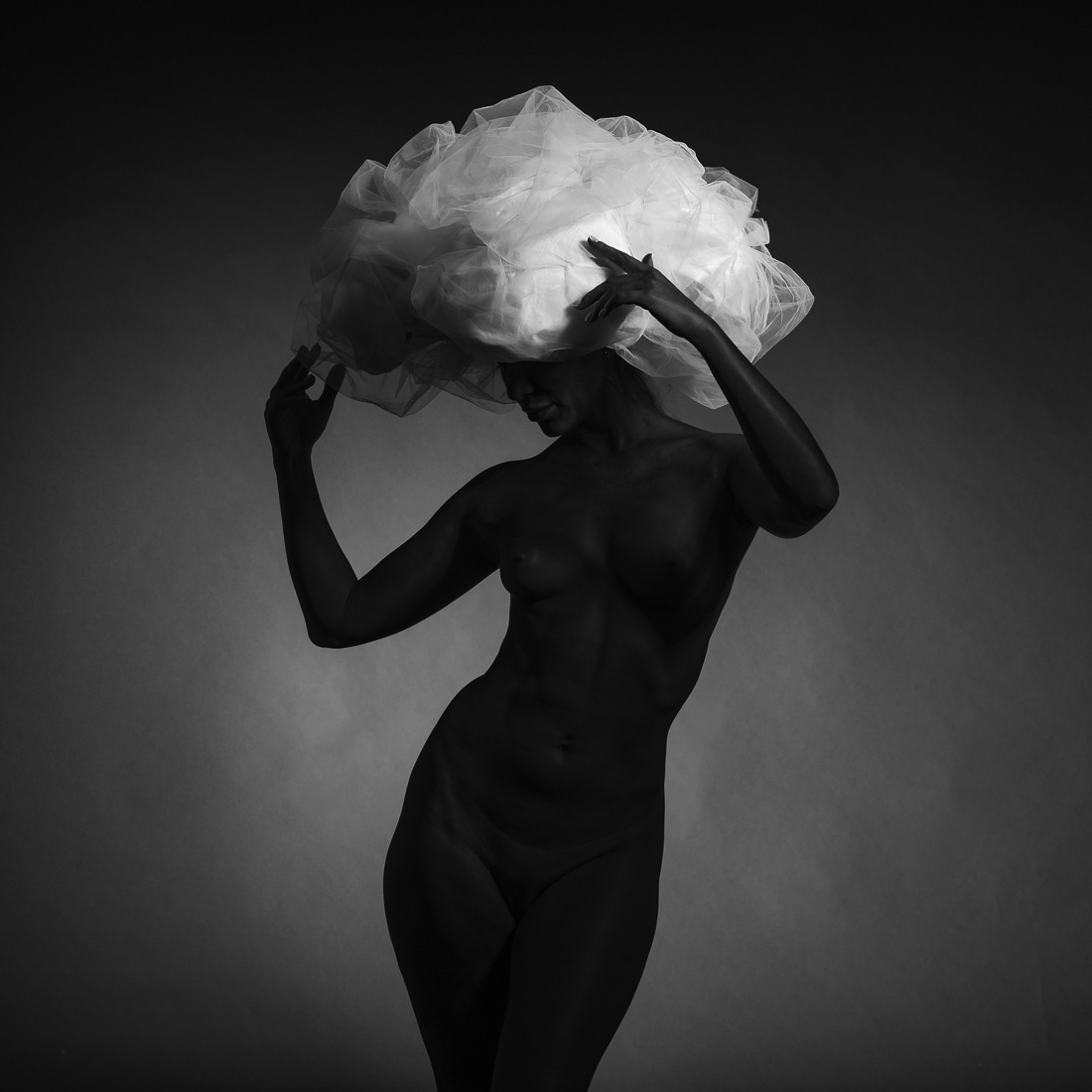 Black model and big white hat.